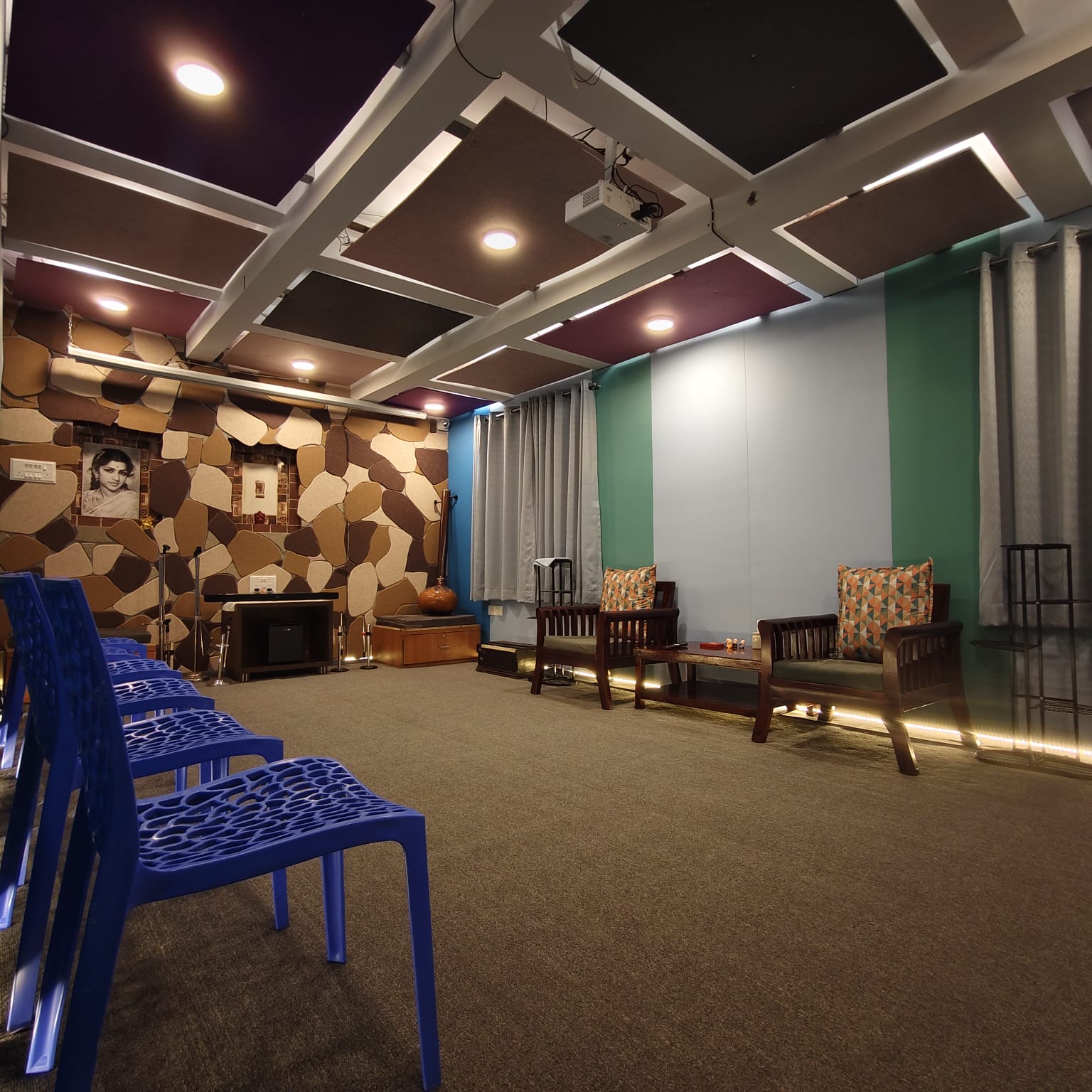 Complete acoustic rock feature wall and flexible seating inside Varnam Studio